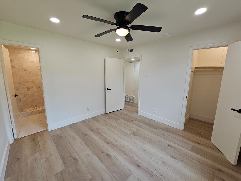 1725 R Avenue, Unit 1725 Plano, TX 75074 - Photo 12 of 20 Spacious room featuring wood-finish flooring, a ceiling fan with light fixture, and recessed lighting