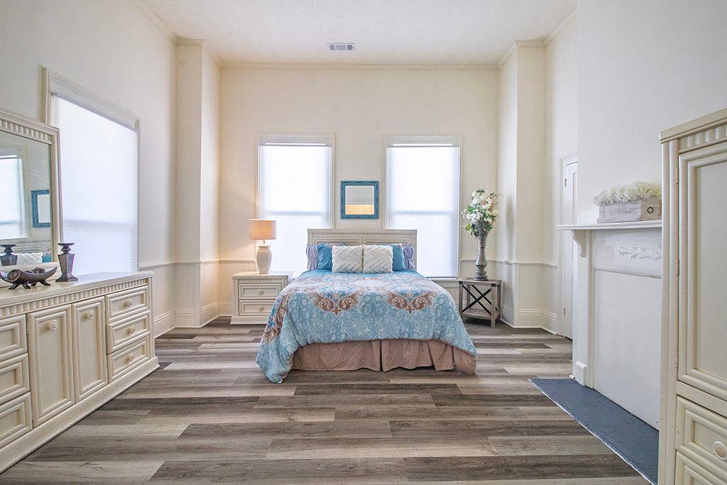 65 West Calhoun Street Wadley, GA 30477 - Photo 13 of 25 a spacious bedroom with a bed and a large window