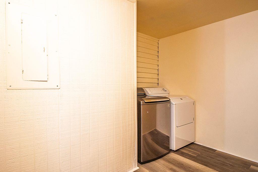 65 West Calhoun Street Wadley, GA 30477 - Photo 15 of 25 a kitchen with a refrigerator and cabinets