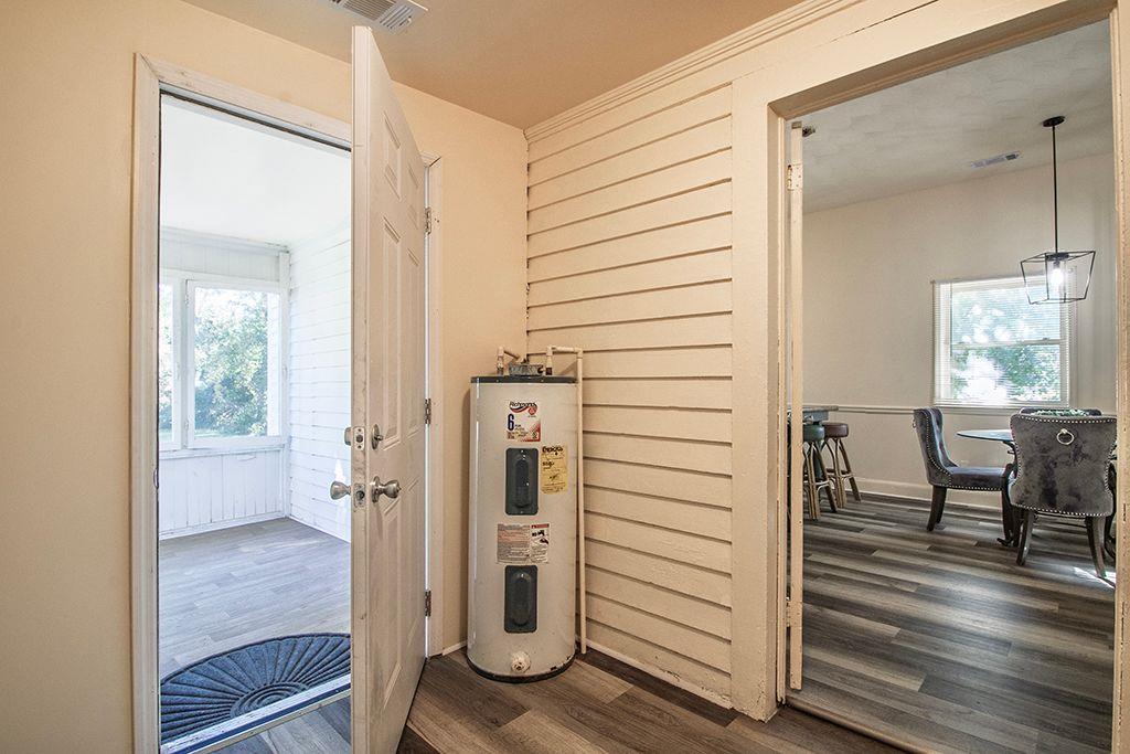 65 West Calhoun Street Wadley, GA 30477 - Photo 16 of 25 a view of a hallway with wooden floor and staircase