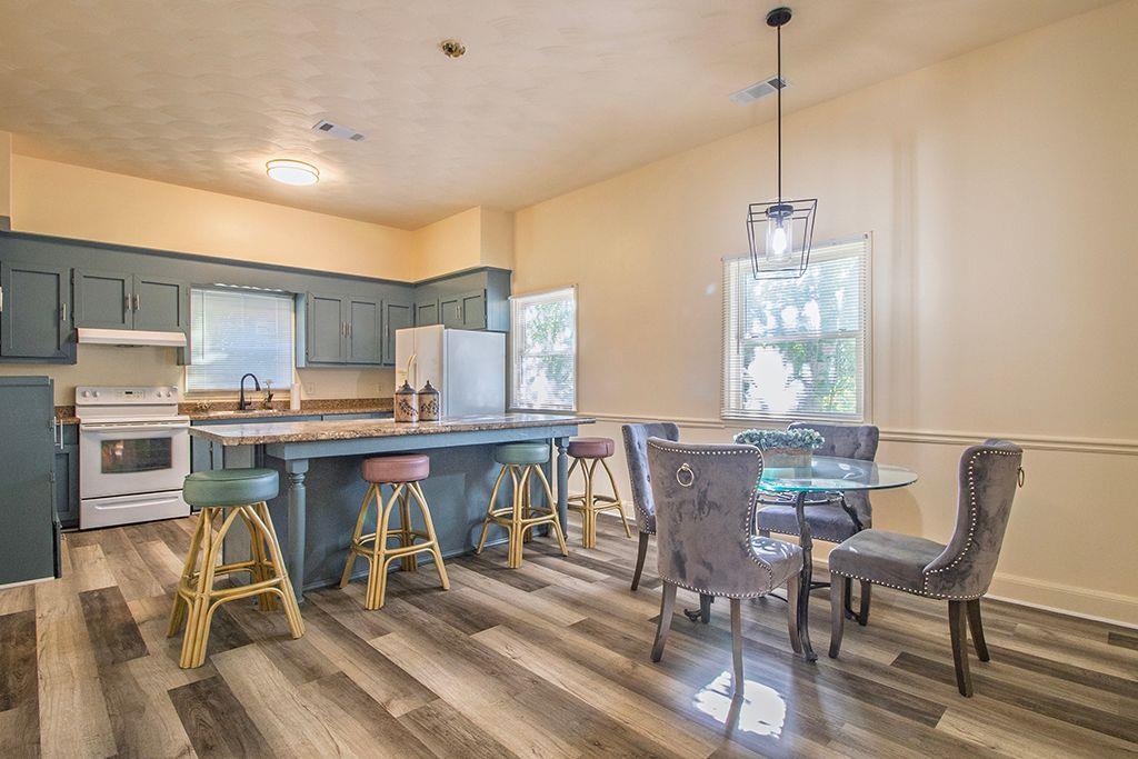 65 West Calhoun Street Wadley, GA 30477 - Photo 6 of 25 a view of a dining room with furniture window and wooden floor