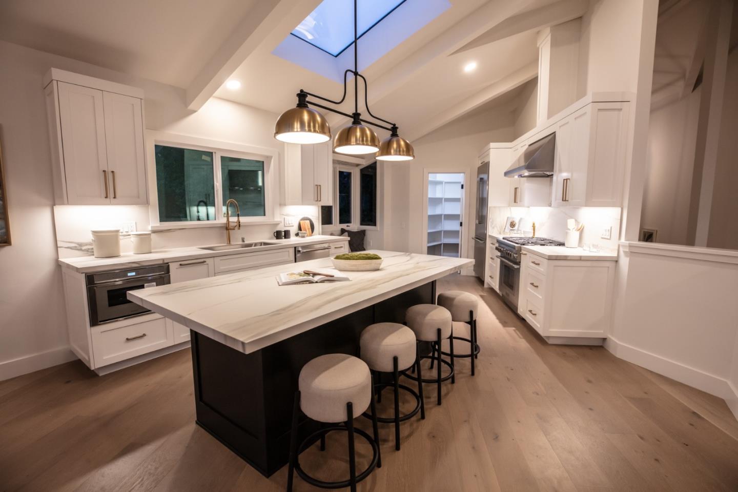 250 Hardwick Road Woodside, CA 94062 - Photo 16 of 65 a kitchen that has a sink and a stove with wooden floor