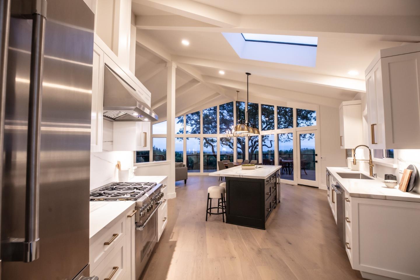 250 Hardwick Road Woodside, CA 94062 - Photo 22 of 65 a kitchen with stainless steel appliances granite countertop a stove refrigerator and a sink