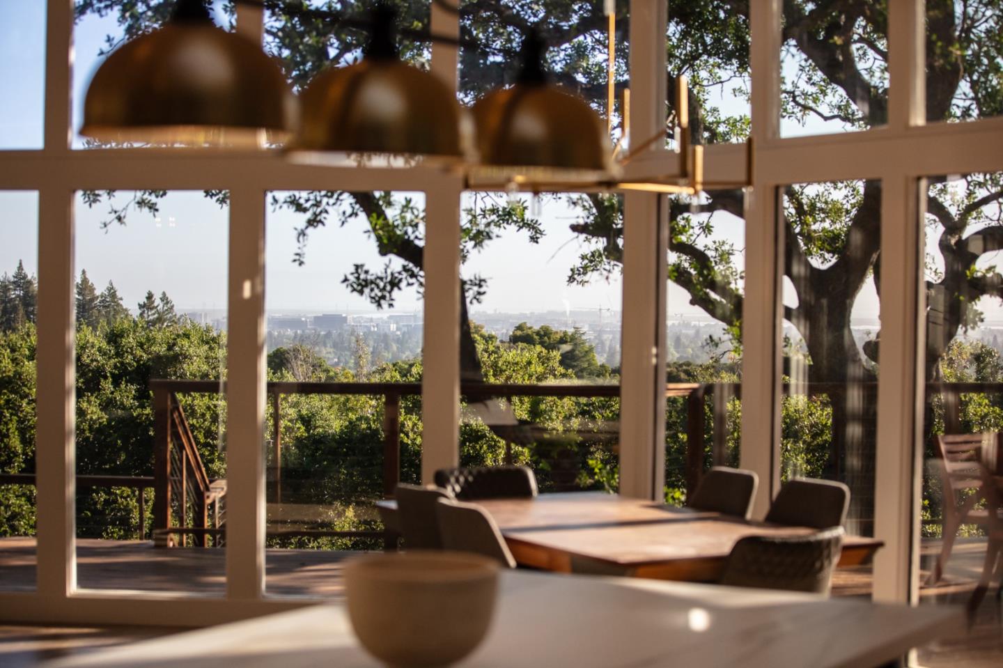 250 Hardwick Road Woodside, CA 94062 - Photo 26 of 65 a view of a patio with a table and chairs