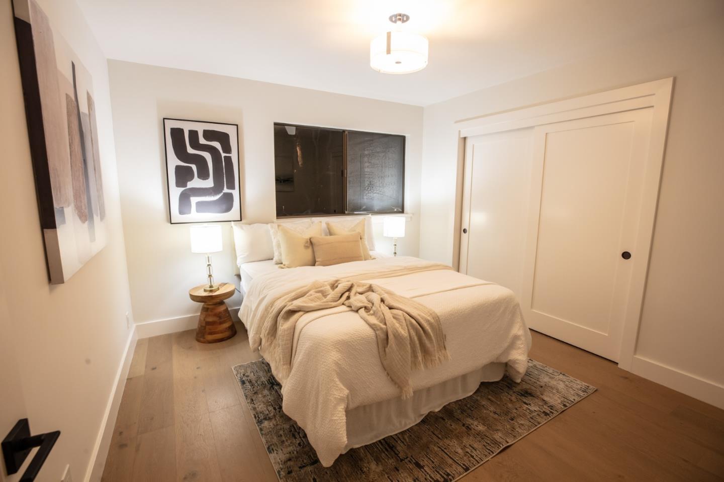 250 Hardwick Road Woodside, CA 94062 - Photo 41 of 65 a bedroom with a large bed and a window