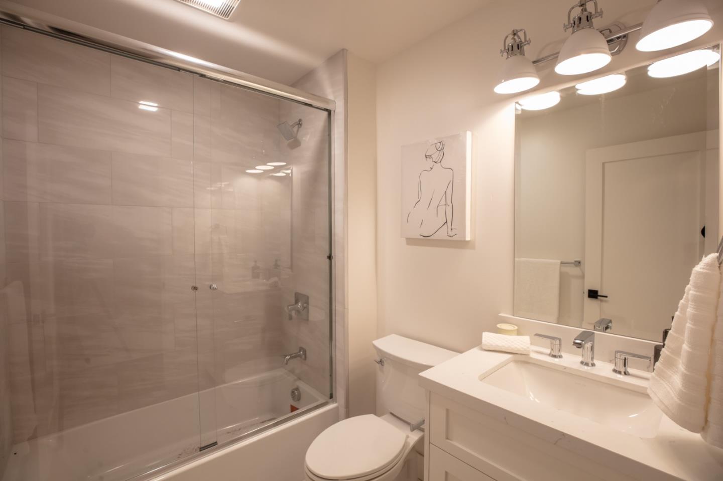 250 Hardwick Road Woodside, CA 94062 - Photo 42 of 65 a bathroom with a sink toilet tub and shower