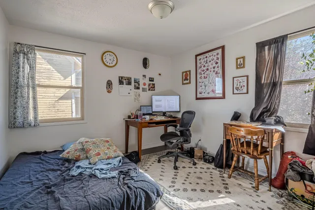 a bedroom with furniture a bed and a window