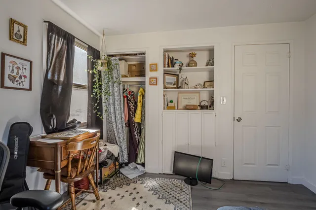 a view of a livingroom with furniture and gym equipment