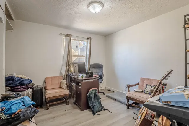 a workspace with furniture and a window