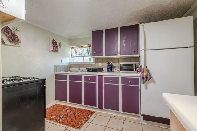 a view of a dining room with furniture and a livingroom