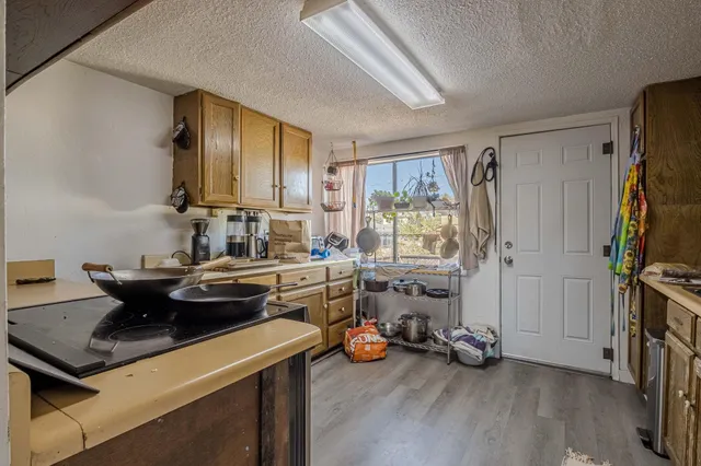 a view of a livingroom with lounge chair and a window