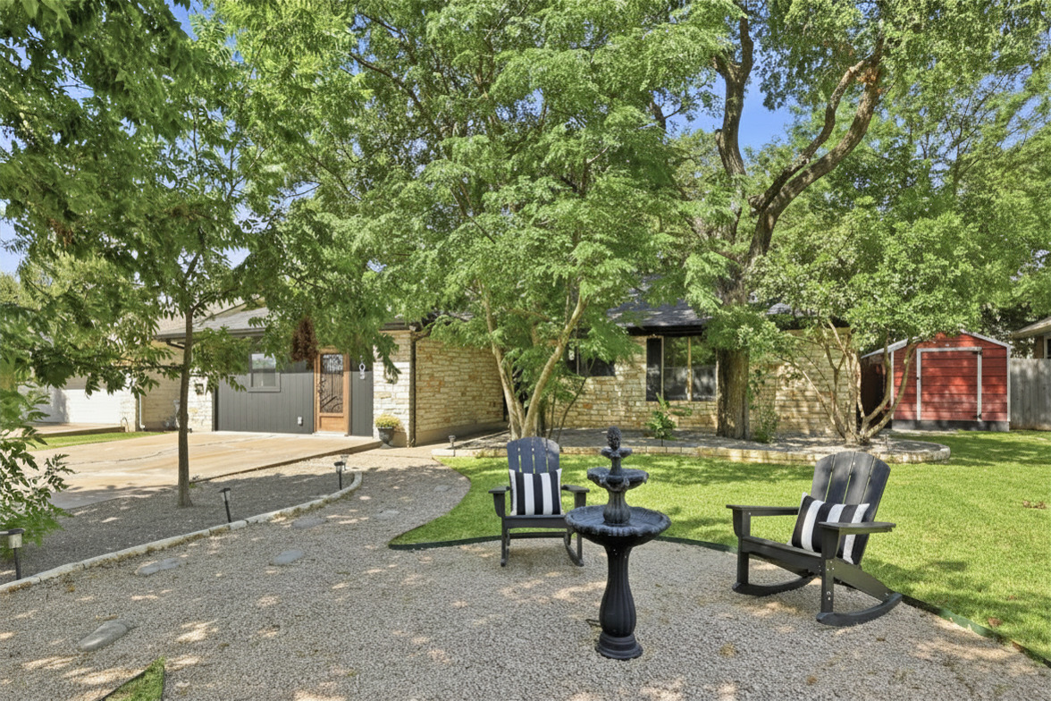 303 Pin Oak Drive Georgetown, TX 78628 - Photo 2 of 36 a backyard of a house with table and chairs