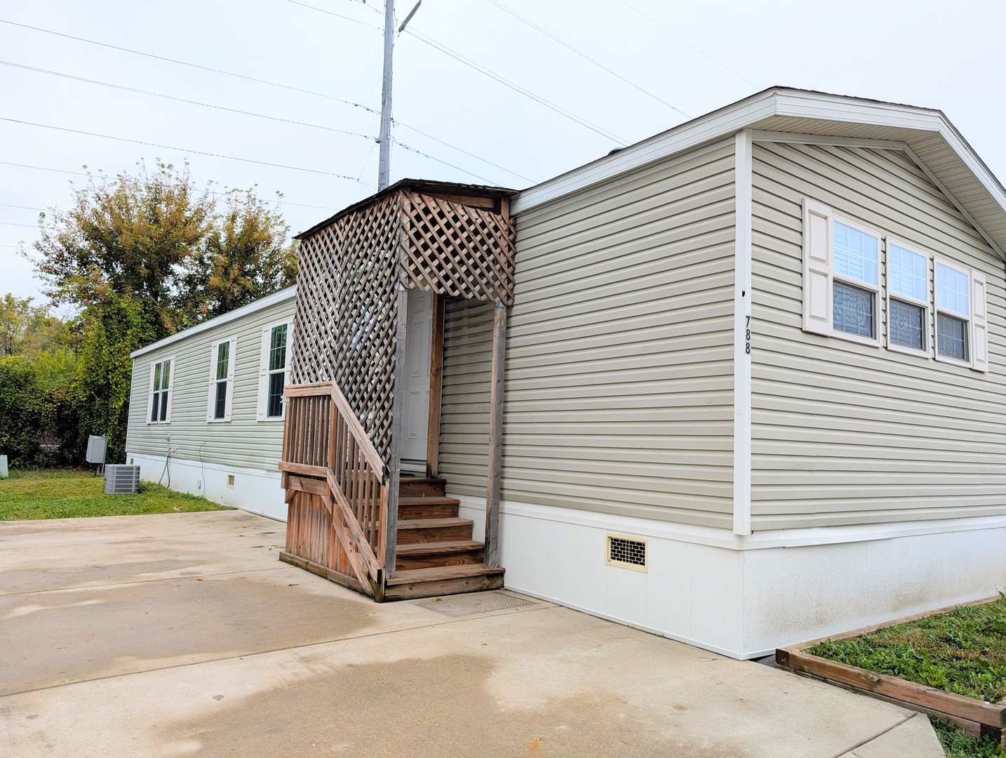 a view of a house with a yard and deck