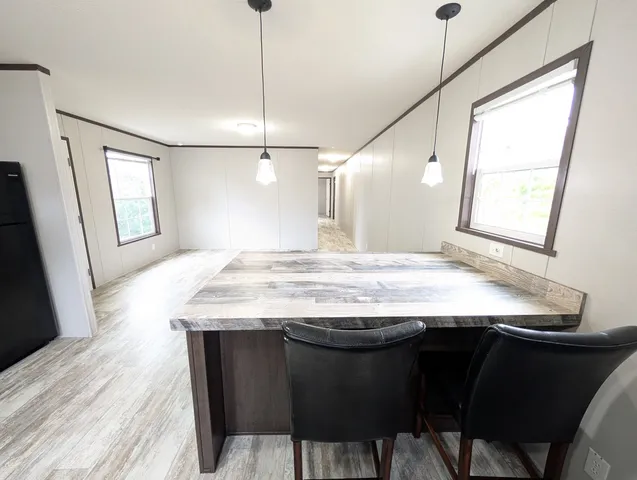 a view of a kitchen counter space and wooden floor