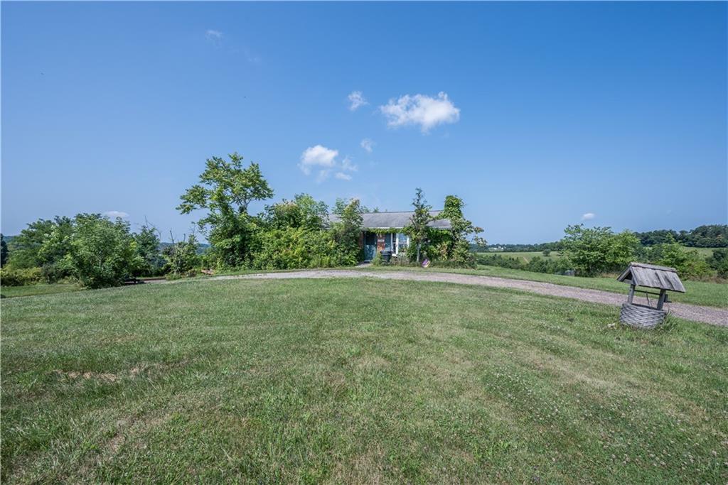 776 Mounts Road Washington, PA 15301 - Photo 1 of 40 a view of a green field with lots of bushes