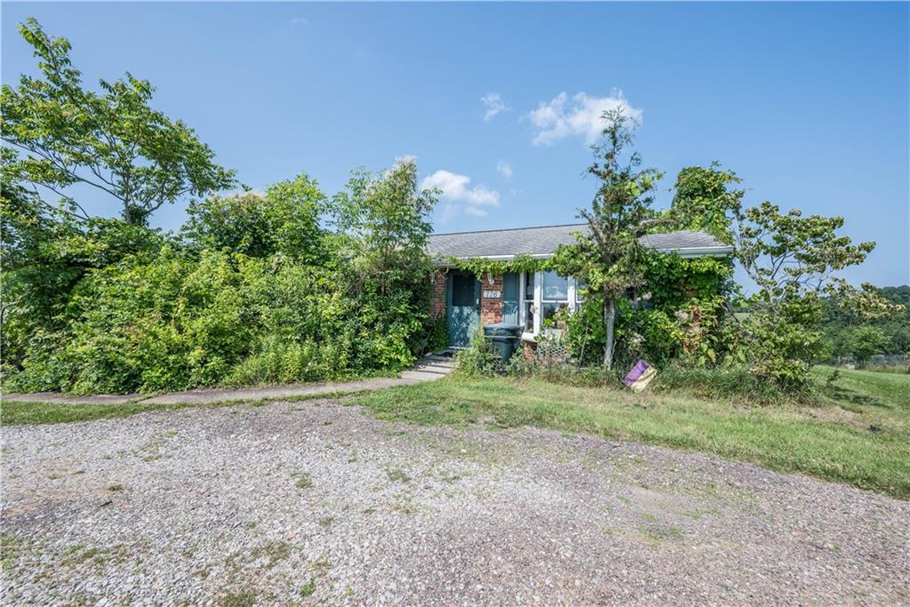 776 Mounts Road Washington, PA 15301 - Photo 2 of 40 a view of a house with a yard and potted plants
