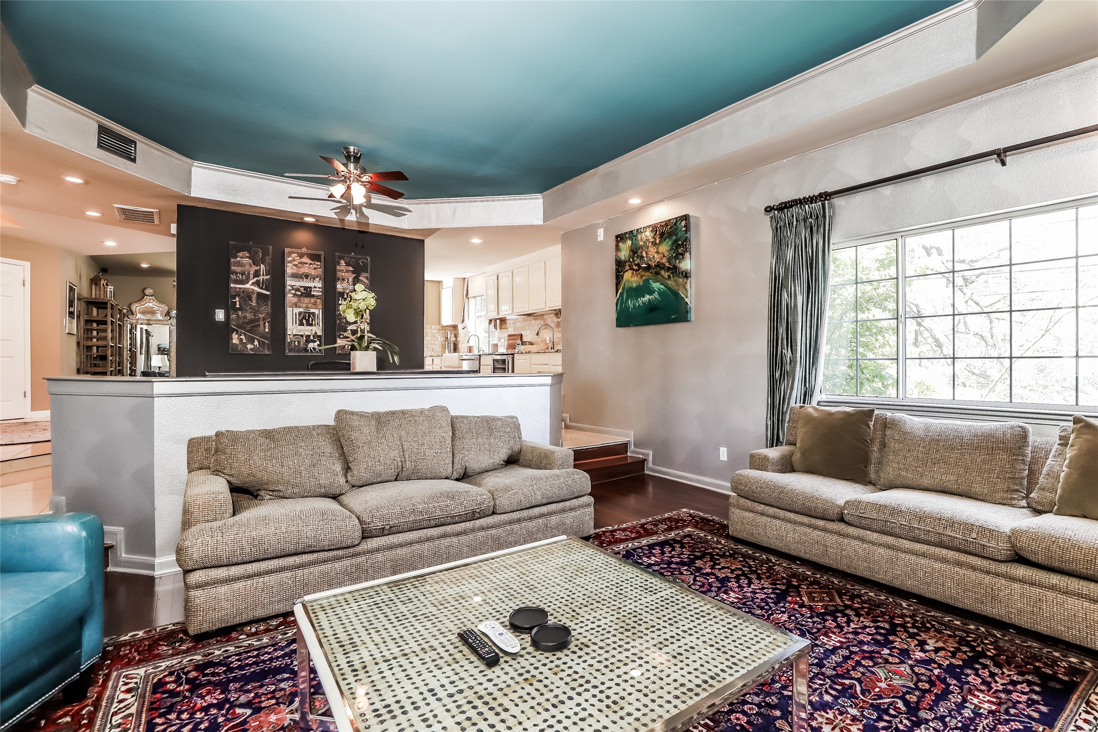 1702 Newning Avenue, Unit A Austin, TX 78704 - Photo 4 of 20 Living area featuring a tray ceiling with a ceiling fan, recessed lighting, and a large window