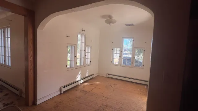 a kitchen with stainless steel appliances granite countertop a sink a stove a refrigerator and cabinets