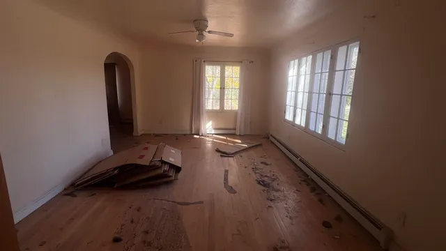 a bathroom with a toilet and a mirror
