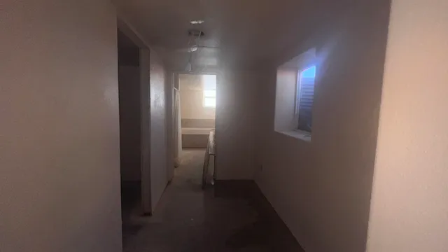 a view of a house with a yard and tree s