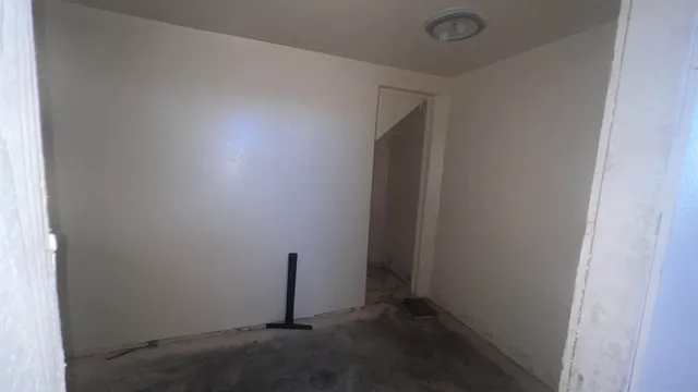 a kitchen with stainless steel appliances granite countertop a stove sink microwave and window