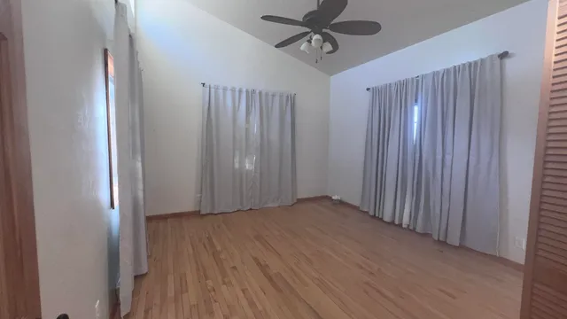 a bathroom with a toilet sink a mirror and vanity