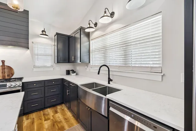 a kitchen with a sink and cabinets