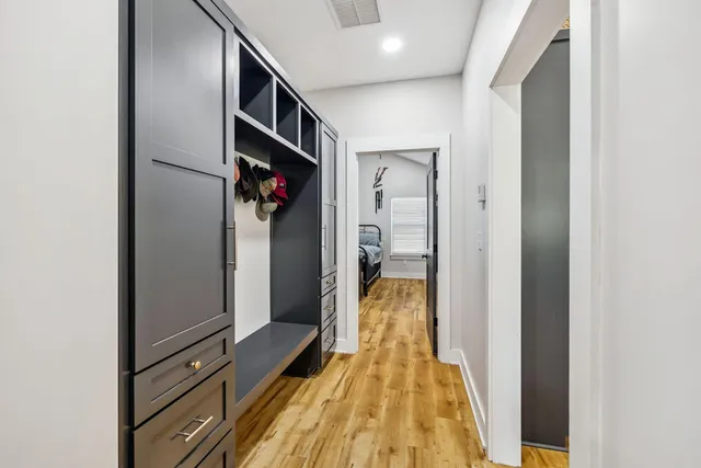 a view of hallway with wooden floor