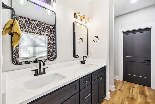 a bathroom with a sink and a mirror