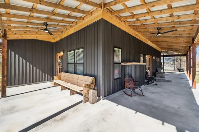 a view of a living room and floor to ceiling window
