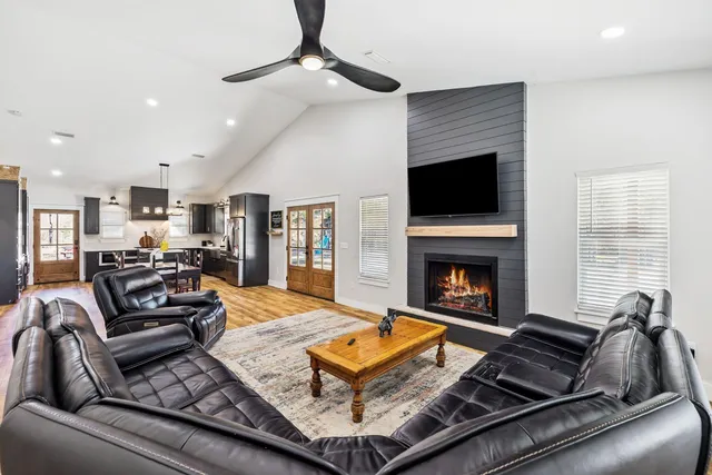 a living room with furniture and a fireplace