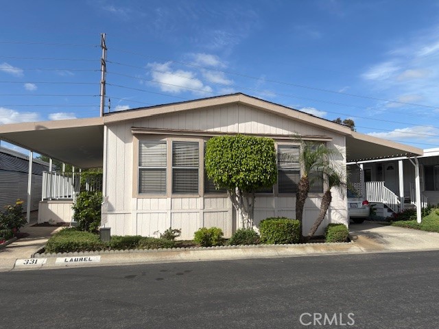 14851 Jeffrey Road, Unit 331 Irvine, CA 92618 - Photo 1 of 12 a front view of a house with a garden