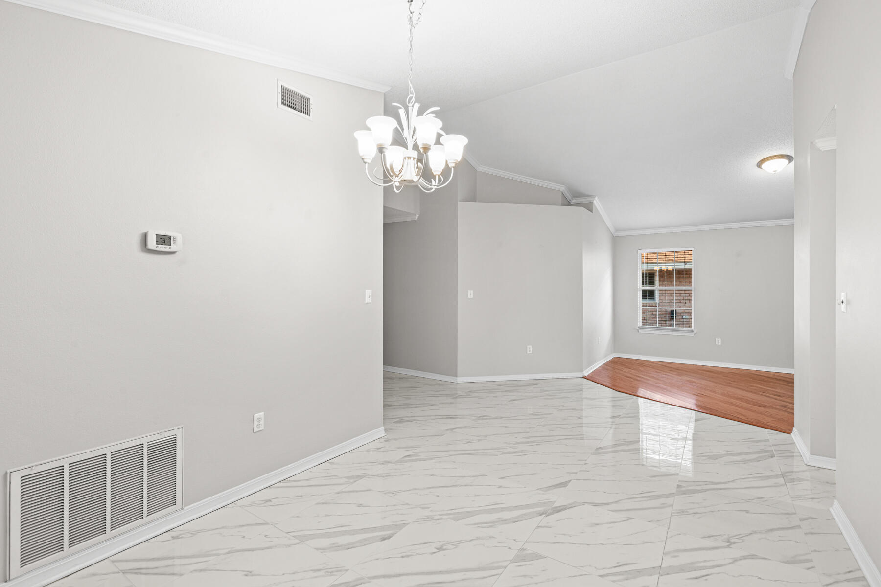 4666 Sunsail Circle Destin, FL 32541 - Photo 19 of 41 a view of an empty room with a chandelier