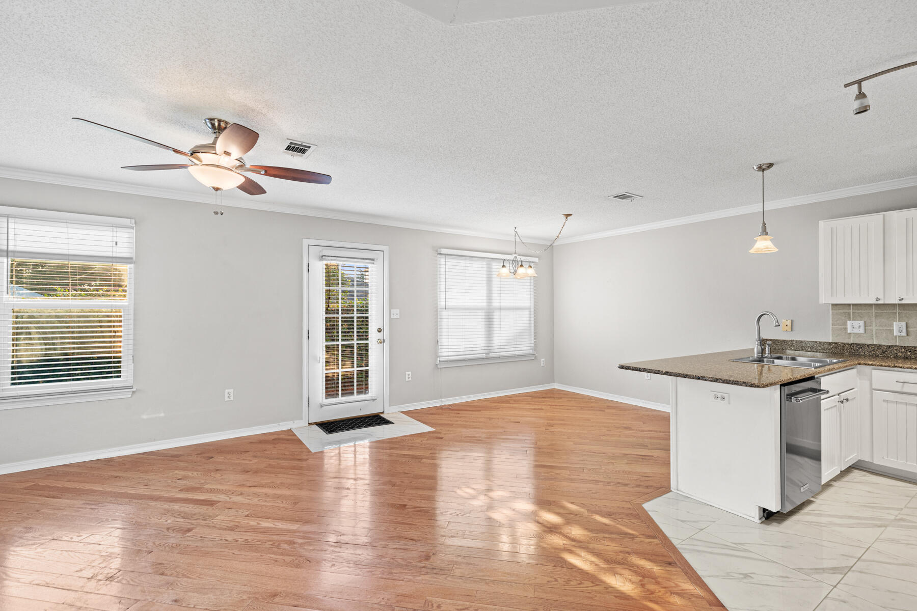 4666 Sunsail Circle Destin, FL 32541 - Photo 27 of 41 a view of a kitchen with a sink cabinets and wooden floor