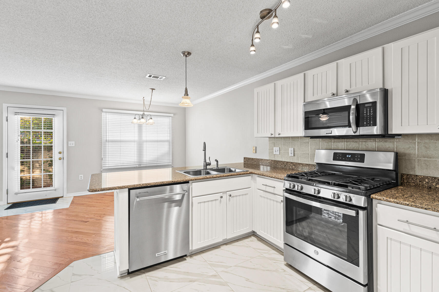 4666 Sunsail Circle Destin, FL 32541 - Photo 28 of 41 a kitchen with stainless steel appliances granite countertop a stove a sink and a microwave