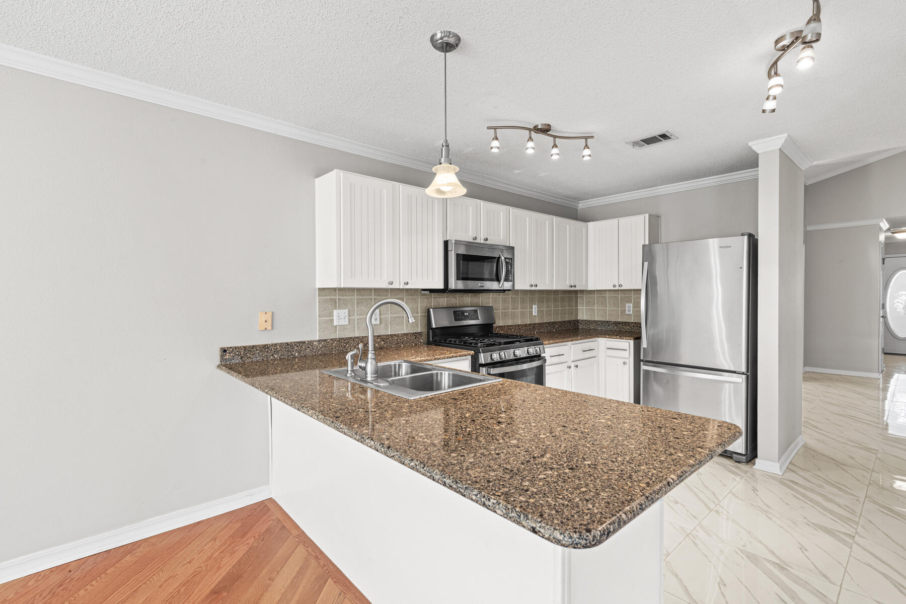 4666 Sunsail Circle Destin, FL 32541 - Photo 29 of 41 a kitchen with stainless steel appliances granite countertop a sink refrigerator and microwave