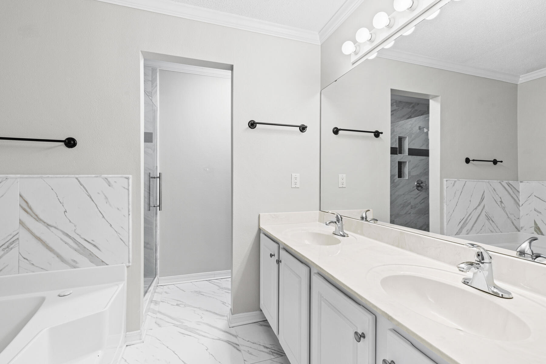 4666 Sunsail Circle Destin, FL 32541 - Photo 35 of 41 a bathroom with a double vanity sink a mirror and a shower