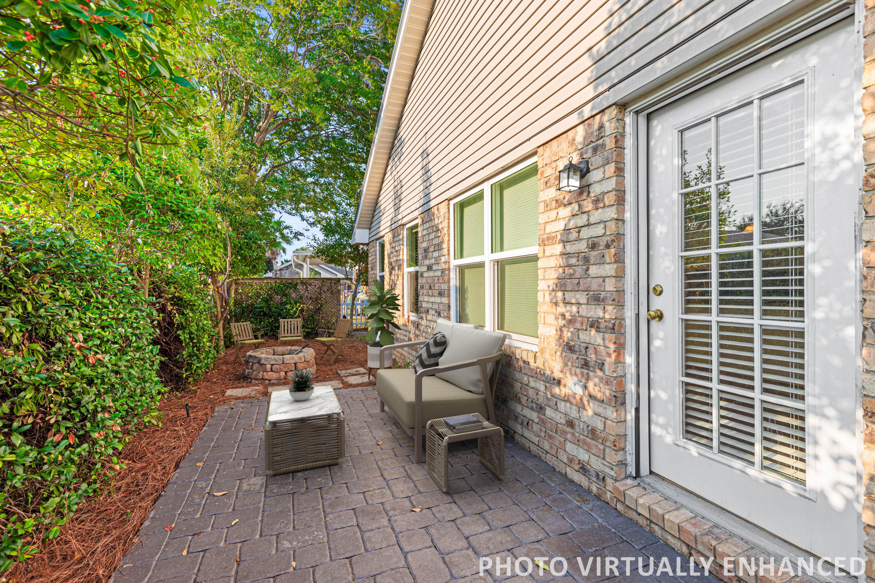 4666 Sunsail Circle Destin, FL 32541 - Photo 5 of 41 a view of a patio with table and chairs and potted plants