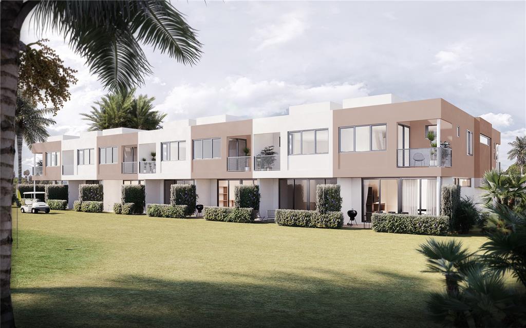 724 Cypress Grove Drive, Unit 724 Pompano Beach, FL 33069 - Photo 5 of 8 a view of residential houses with yard and road