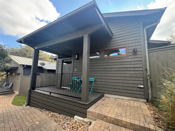 a view of porch with wooden stairs