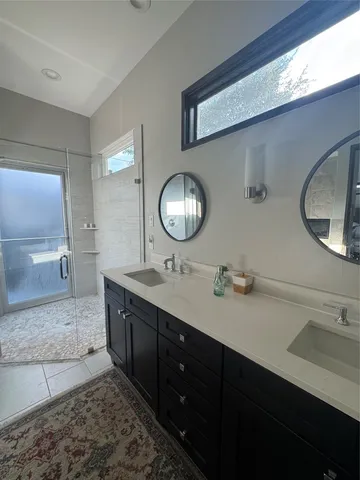a spacious bathroom with a sink and a bathtub