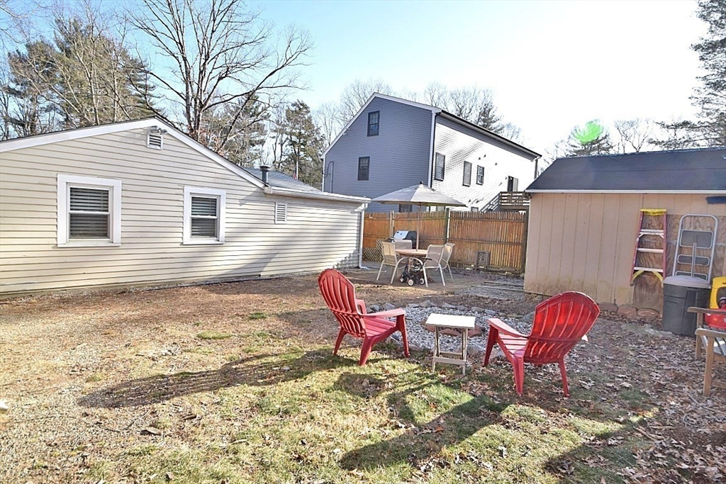 17 Kalmia Road Holbrook, MA 02343 - Photo 3 of 27 a backyard of a house with table and chairs
