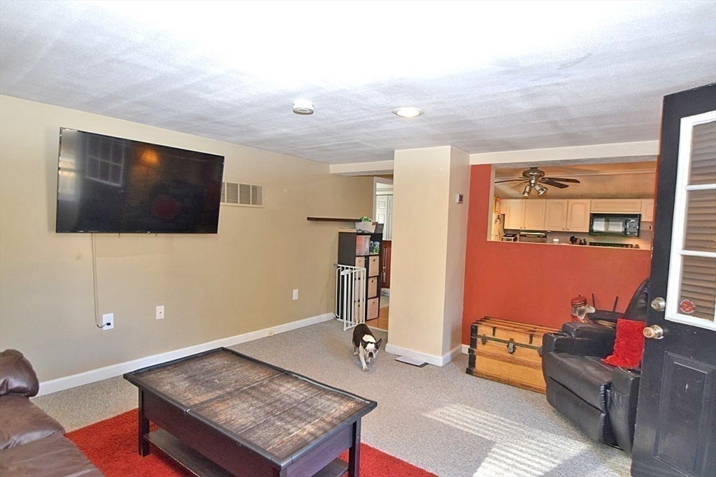 17 Kalmia Road Holbrook, MA 02343 - Photo 10 of 27 a living room with furniture and a flat screen tv