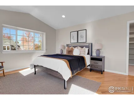 a bedroom with a bed lamps and window