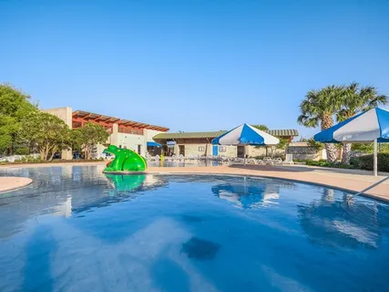 a view of swimming pool with a patio