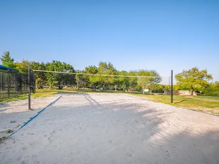 a view of swimming pool with a patio