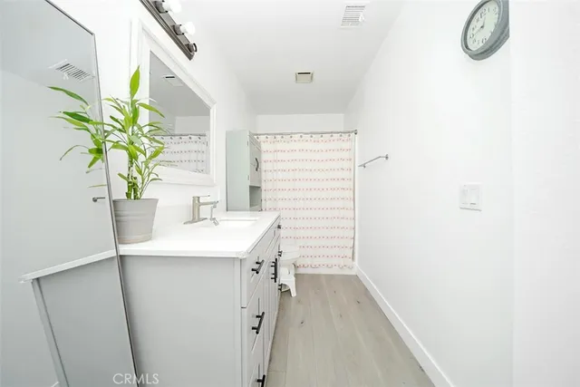 a bathroom with a sink a vanity and a mirror