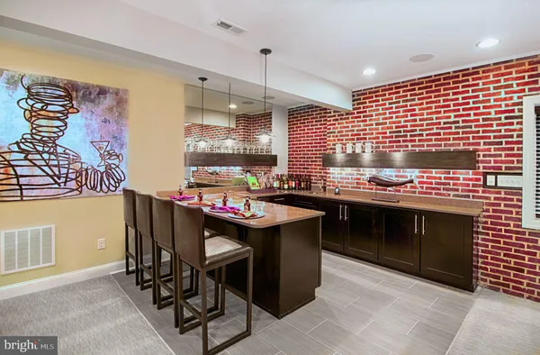 a kitchen with granite countertop a sink and cabinets
