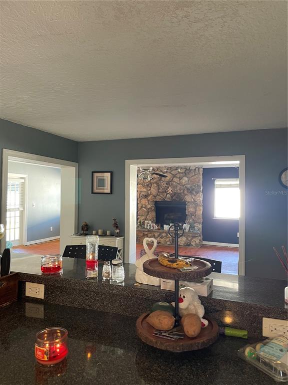 879 Little Bend Road Altamonte Springs, FL 32714 - Photo 11 of 23 a living room with furniture and a table