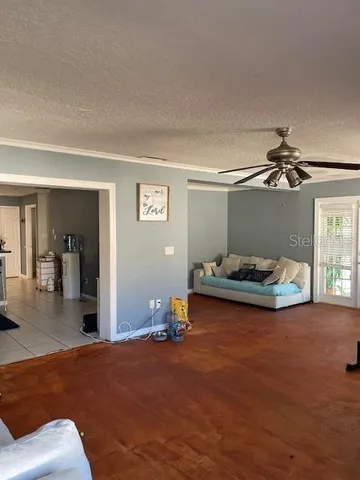 a bedroom with furniture and a chandelier